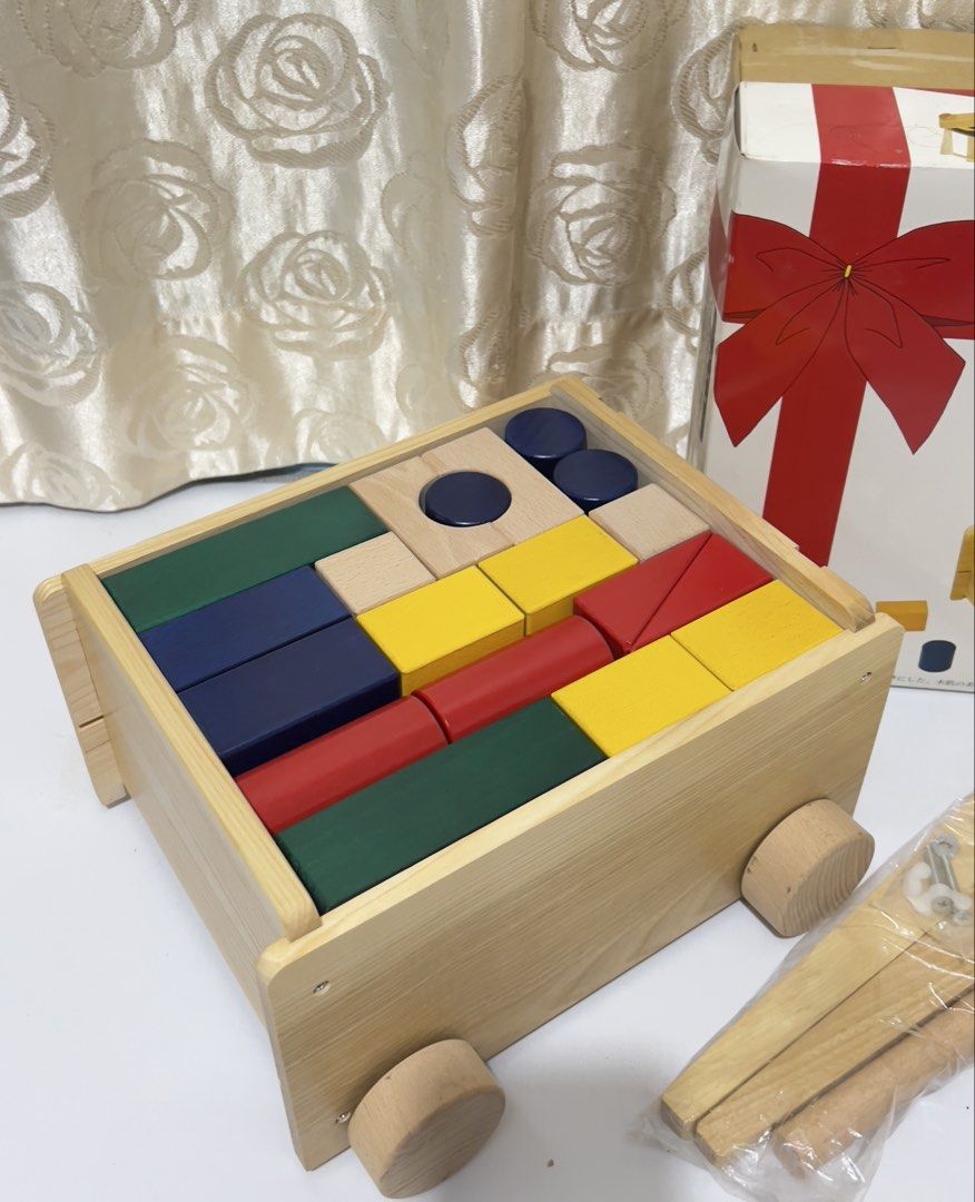 KOIDE Wooden Walker with Blocks (Brandnew) (Category: Infant Playtime) located in Taguig. Submitted by ms_sophistic8ted (Listing ID 1460204115, Image 2). Description: - KOIDE Wooden Walker and Block Set - Push walker with wheels and handle - Includes colorful wooden blocks for stacking and play - Aids in developing motor skills - All blocks shown in the box are included - Features a gift ribbon design on the box Taguig ship Lalamove mop:BPI or Gc