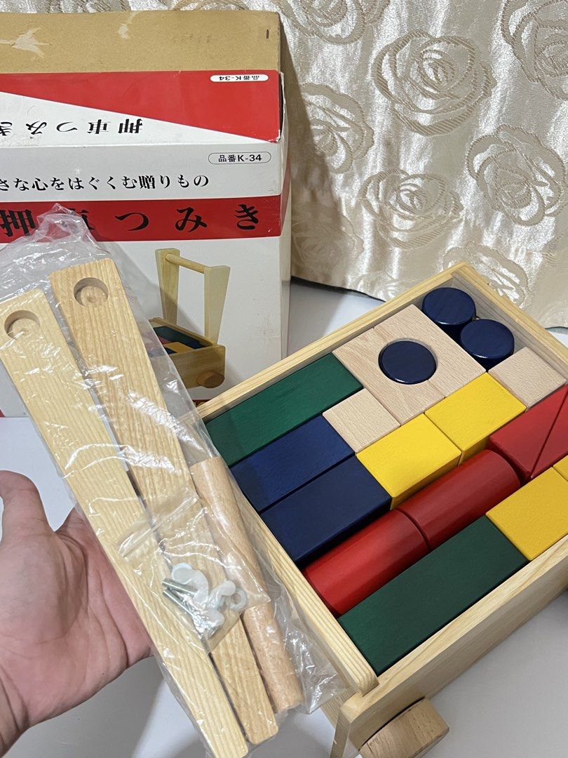 KOIDE Wooden Walker with Blocks (Brandnew) (Category: Infant Playtime) located in Taguig. Submitted by ms_sophistic8ted (Listing ID 1460204115, Image 3). Description: - KOIDE Wooden Walker and Block Set - Push walker with wheels and handle - Includes colorful wooden blocks for stacking and play - Aids in developing motor skills - All blocks shown in the box are included - Features a gift ribbon design on the box Taguig ship Lalamove mop:BPI or Gc