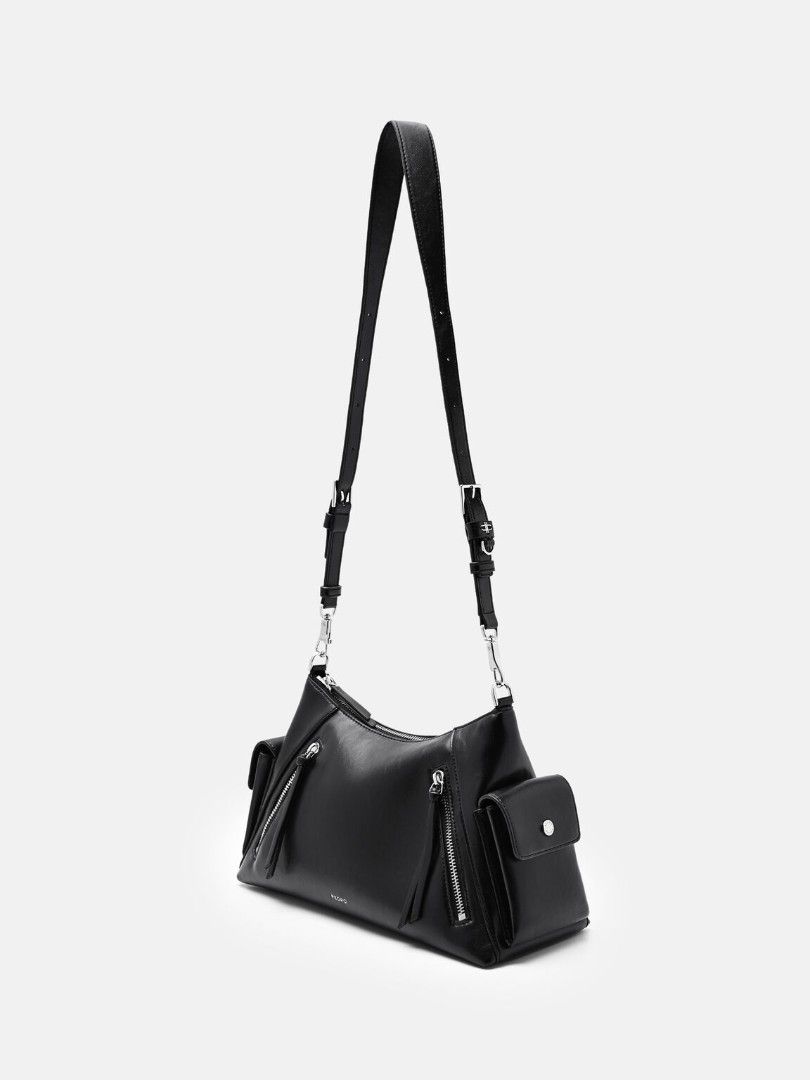 Kristen Shoulder Bag - Black (Category: Luxury Bags & Wallets) located in Makati City. Submitted by zoeppe_online (Listing ID 1460298711, Image 3). Description: Defined by a utilitarian-inspired aesthetic, this slouchy shoulder bag is punctuated by functional zip details and structured side pockets. It features a wide, adjustable strap with polished hardware for a customizable fit. A contemporary take on the carry-all, balancing tactile softness 