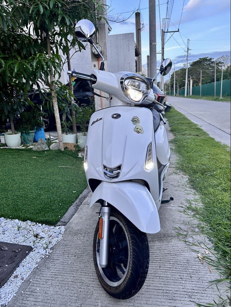 Kymco Like 150i White Scooter (Category: Skates, Rollerblades & Scooters) located in Manila. Submitted by lucky333888 (Listing ID 1460143879, Image 2). Description: - White Kymco Like 150i scooter - Extremely low mileage: only 1282 km - Digital display with time and temperature - All lights are working - Comfortable seat with backrest - Ideal for city rides - Ready for a new owner PM is the key.
