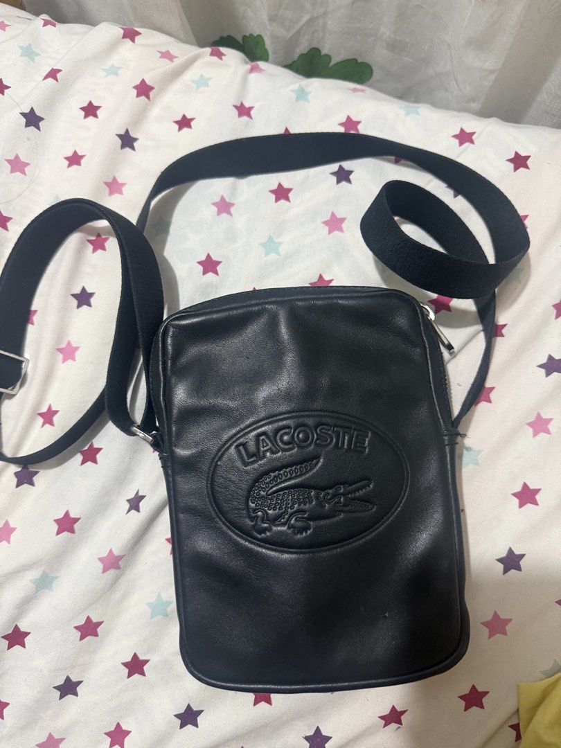 Lacoste Black Leather Crossbody Bag (Category: Sling Bags) located in Manila. Submitted by christian_bird (Listing ID 1460293413, Image 1). Description: - Authentic Lacoste black leather crossbody bag - Adjustable strap for comfortable crossbody wear - Small mark on the front leather, clearly shown in photos Condition: 8.5/10 100% orig.