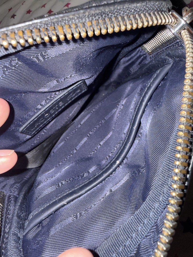 Lacoste Black Leather Crossbody Bag (Category: Sling Bags) located in Manila. Submitted by christian_bird (Listing ID 1460293413, Image 3). Description: - Authentic Lacoste black leather crossbody bag - Adjustable strap for comfortable crossbody wear - Small mark on the front leather, clearly shown in photos Condition: 8.5/10 100% orig.