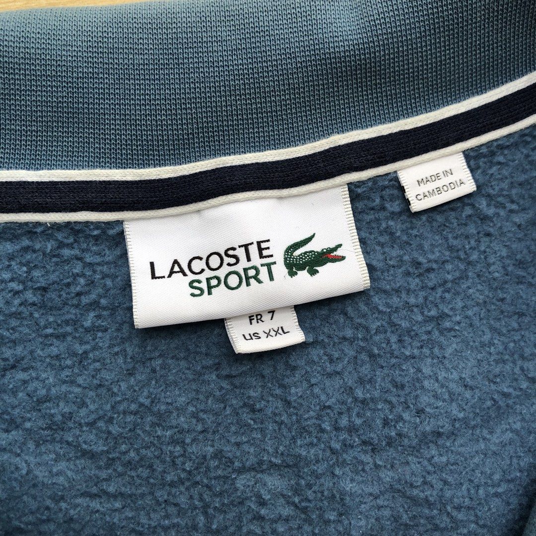 Lacoste full zip turtle neck jacket (Category: Coats, Jackets and Outerwear) located in Cavite. Submitted by nicepicker (Listing ID 1460129729, Image 3). Description: Size on Tag: XXL Dimension: 26 x 28 Condition: 8.5/10 Flaws: Stains.