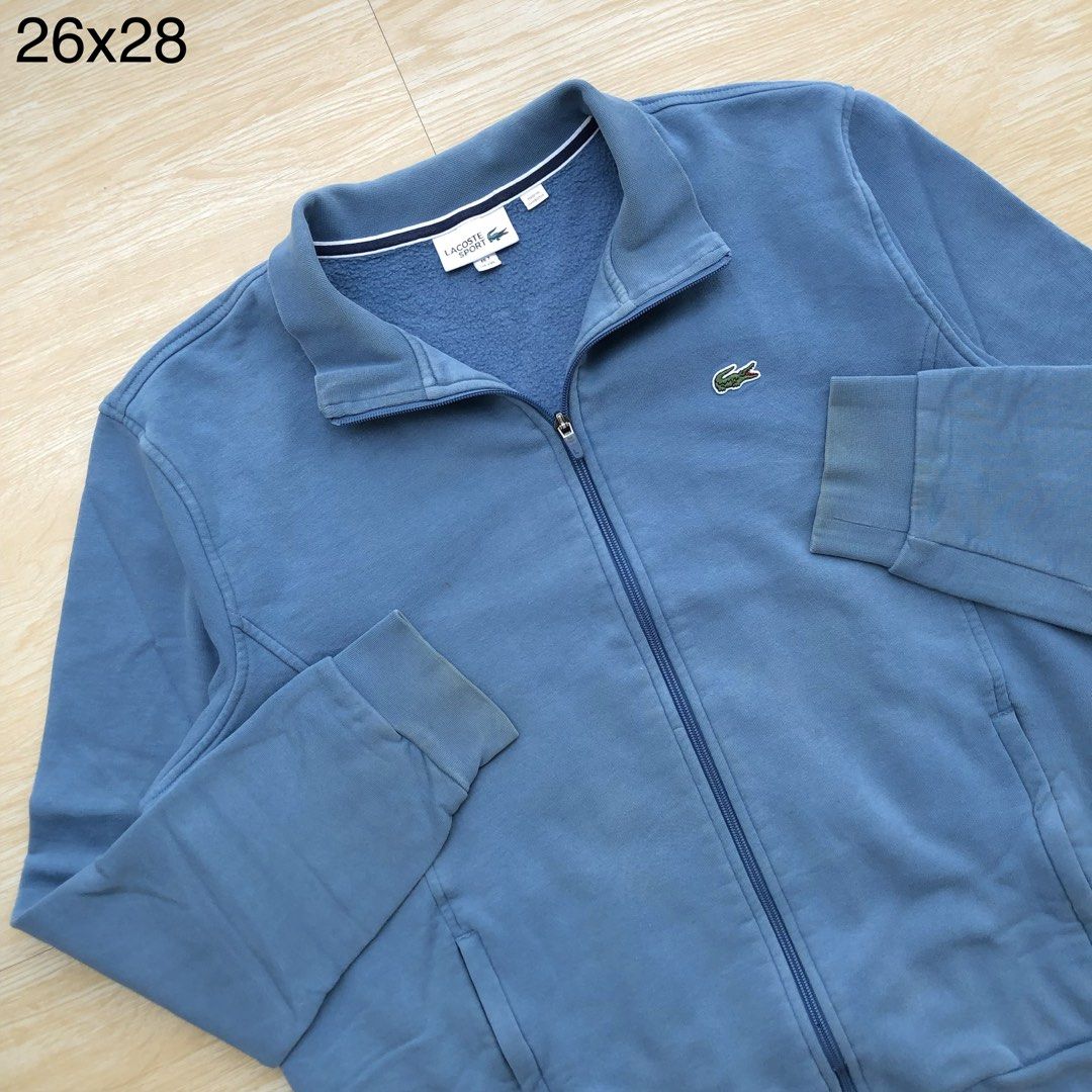 Lacoste full zip turtle neck jacket (Category: Coats, Jackets and Outerwear) located in Cavite. Submitted by nicepicker (Listing ID 1460129729, Image 2). Description: Size on Tag: XXL Dimension: 26 x 28 Condition: 8.5/10 Flaws: Stains.