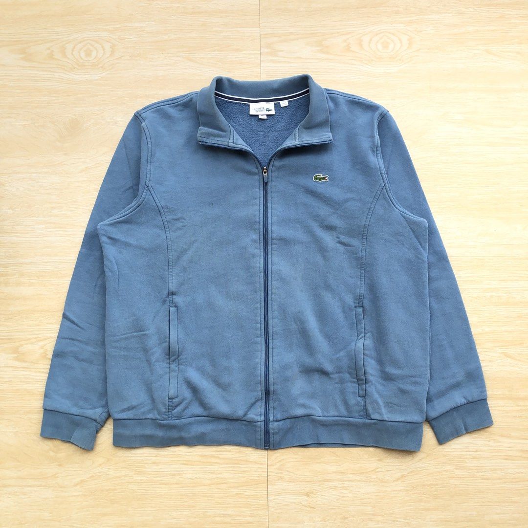 Lacoste full zip turtle neck jacket (Category: Coats, Jackets and Outerwear) located in Cavite. Submitted by nicepicker (Listing ID 1460129729, Image 1). Description: Size on Tag: XXL Dimension: 26 x 28 Condition: 8.5/10 Flaws: Stains.