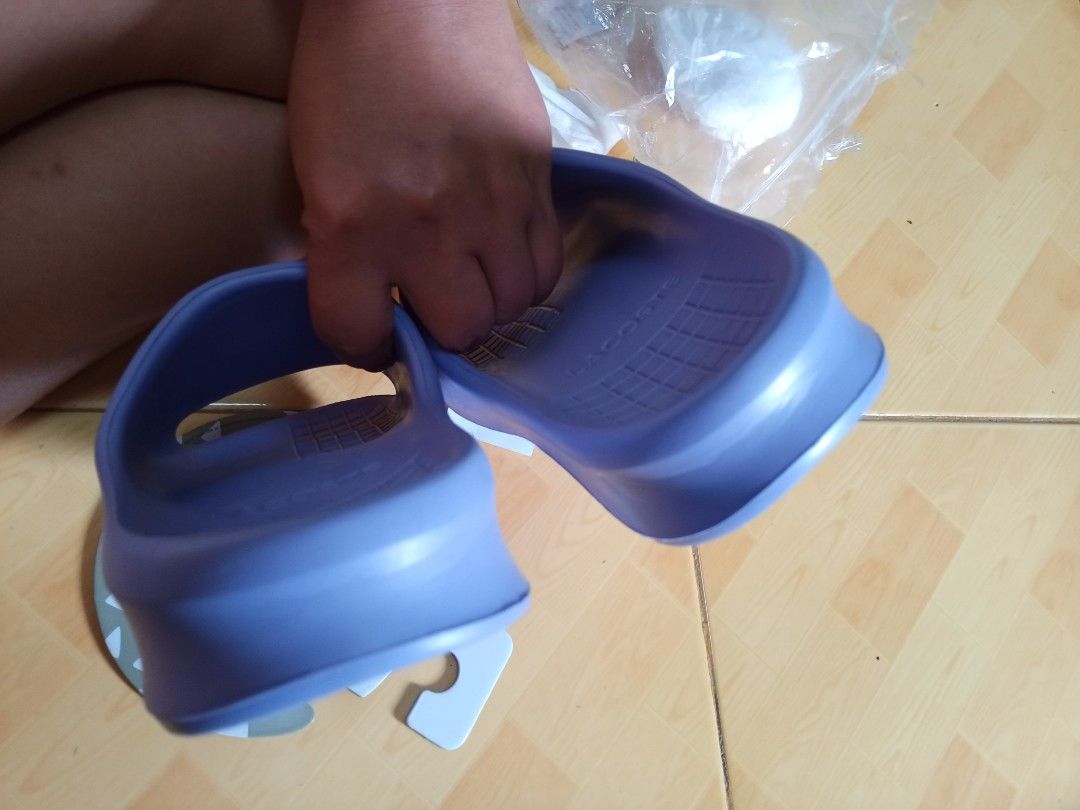 Lacoste Purple Slides with Yellow Logo (Category: Slippers and slides) located in Quezon City. Submitted by pinkishpink08 (Listing ID 1460133723, Image 3). Description: - Authentic Purple Lacoste Slides - Iconic Yellow Logo - Grippy Textured Soles for enhanced traction - Comes with Original Tags and Packaging - Ideal for Casual Wear - Perfect for post-sports relaxation - Easy Slip-on Design - bought in Lacoste u.p town center -with paper bag orig