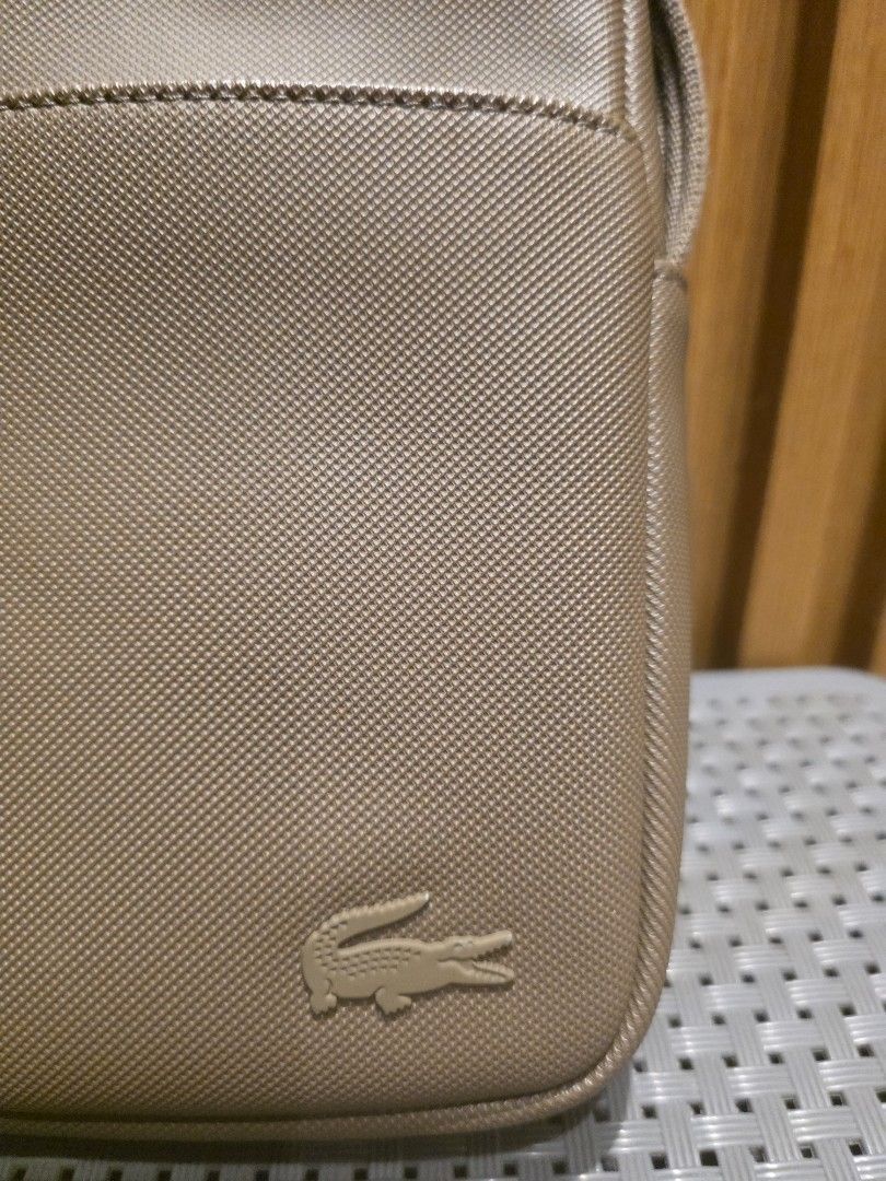 LACOSTE SLING BAG (Category: Luxury Bags & Wallets) located in Manila. Submitted by iantrepreneuer (Listing ID 1460182553, Image 2). Description: Lacoste Sling Bag Lightly Used, in great condition Naked (bag only) no more receipt and paper bag Bought at Lacoste Store Edsa Shangrila.