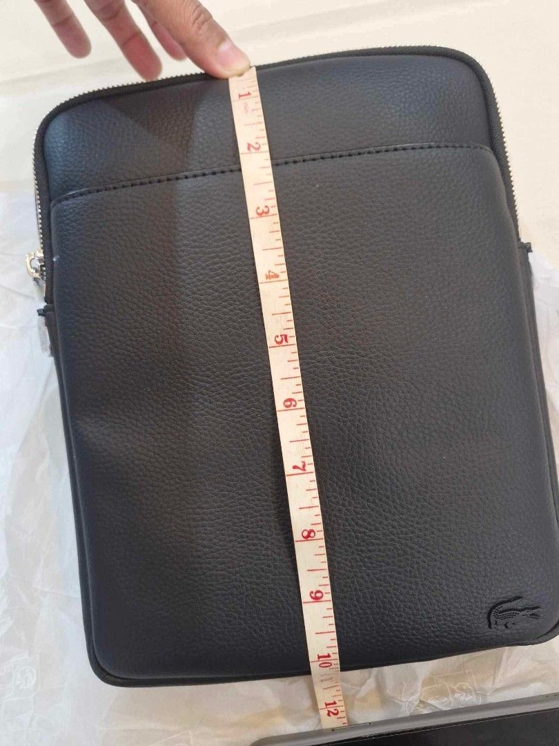 Lacoste sling bag medium size (Category: Sling Bags) located in Manila. Submitted by miamore26 (Listing ID 1460151978, Image 2). Description: with dust bag and paper bag lalamove ready.