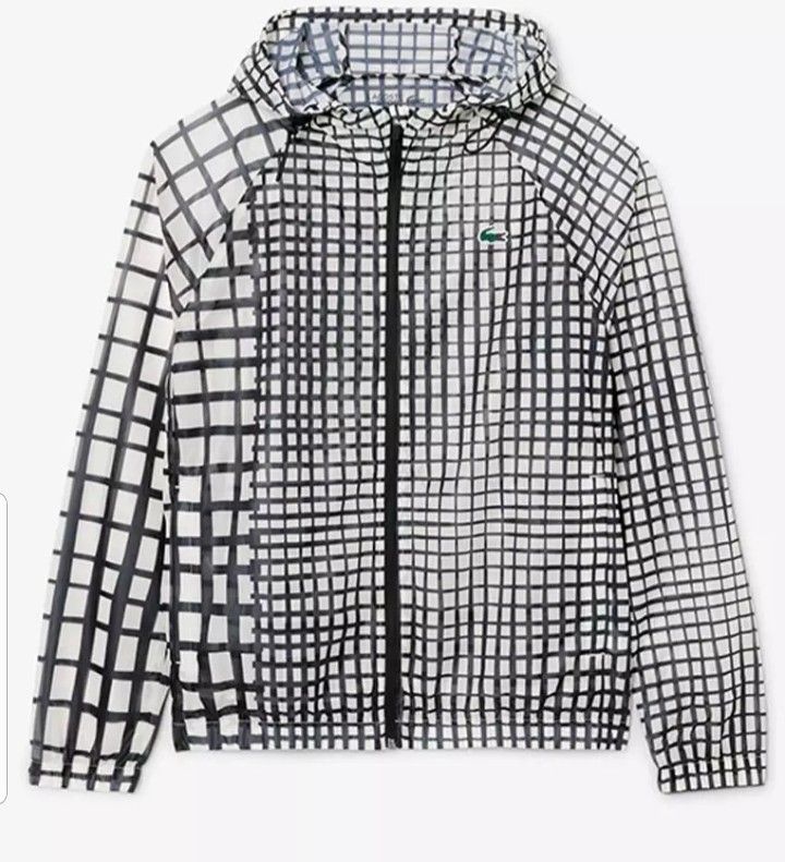Lacoste Windbreaker Jacket (Category: Coats, Jackets and Outerwear) located in San Mateo. Submitted by wellhomes (Listing ID 1460121435, Image 3). Description: - Cool grid pattern windbreaker from Lacoste - Lightweight material, perfect for layering - Features the iconic crocodile logo - Zip-up front with convenient pockets - Hooded design for added protection - Ideal for casual wear or light outdoor activities - AUTHENTIC .