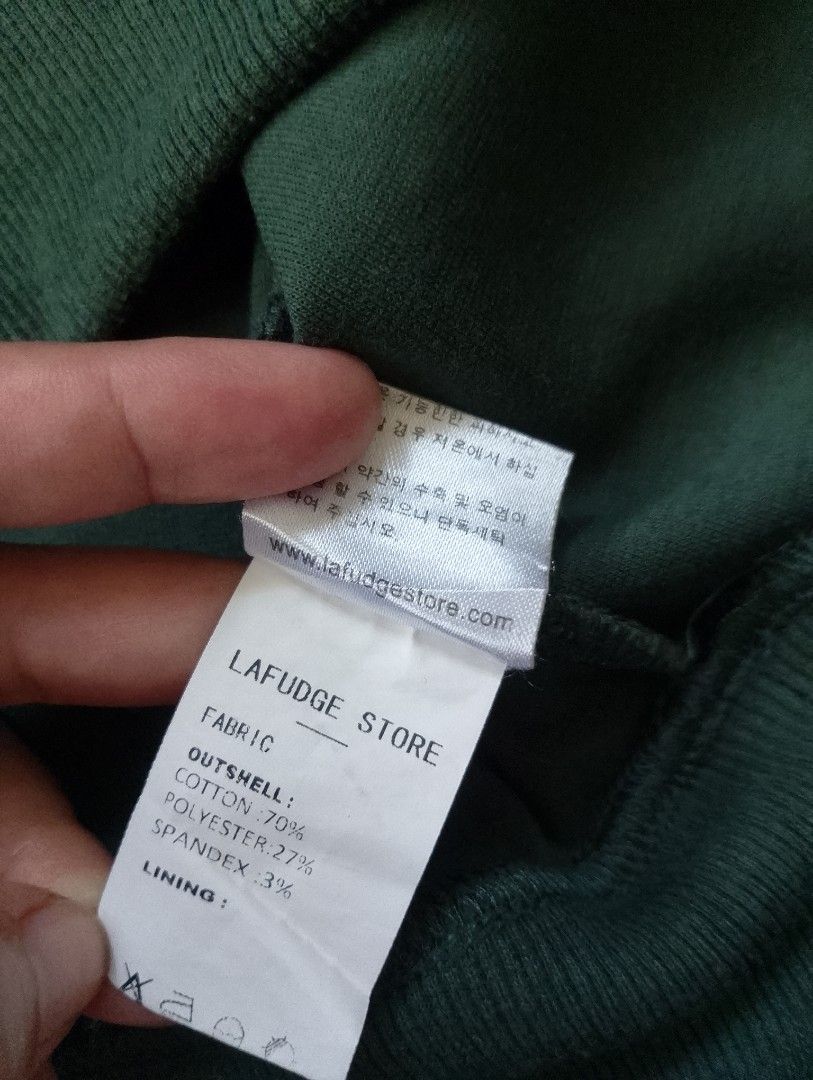 LAFUDGE OUR MAN (Category: Tshirts & Polo Shirts ) located in Cabadbaran. Submitted by ztsfinds (Listing ID 1460142562, Image 3). Description: The item shown in the image is an olive green oversized polo sweatshirt from the Korean streetwear brand LAFUDGE STORE (labeled under their signature tags like "LAFUDGE OUR MAN" or "LAFUDGE STORE"). It features a heavy cotton sweatshirt fabric, a relaxed boxy fit, dropped shoulders, a classic polo collar w