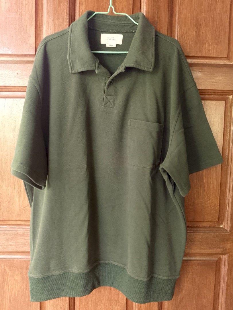 LAFUDGE OUR MAN (Category: Tshirts & Polo Shirts ) located in Cabadbaran. Submitted by ztsfinds (Listing ID 1460142562, Image 1). Description: The item shown in the image is an olive green oversized polo sweatshirt from the Korean streetwear brand LAFUDGE STORE (labeled under their signature tags like "LAFUDGE OUR MAN" or "LAFUDGE STORE"). It features a heavy cotton sweatshirt fabric, a relaxed boxy fit, dropped shoulders, a classic polo collar w