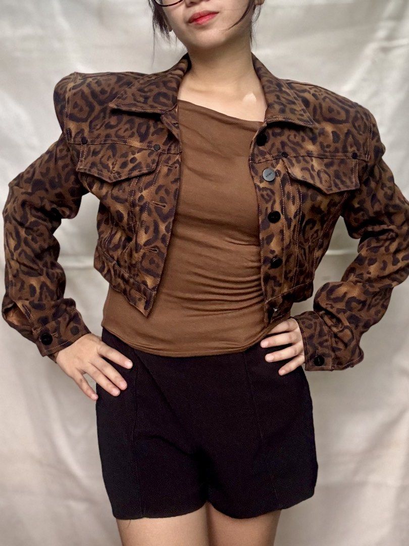 leopard print cropped jacket with padded shoulders (Category: Coats, Jackets and Outerwear) located in Tarlac. Submitted by jyllpreluvd (Listing ID 1460273522, Image 1). Description: - Cool cropped jacket - Bold leopard print - Structured, padded shoulders for a statement look - Button-up front - Chest pockets - Adds an edgy vibe to any outfit.