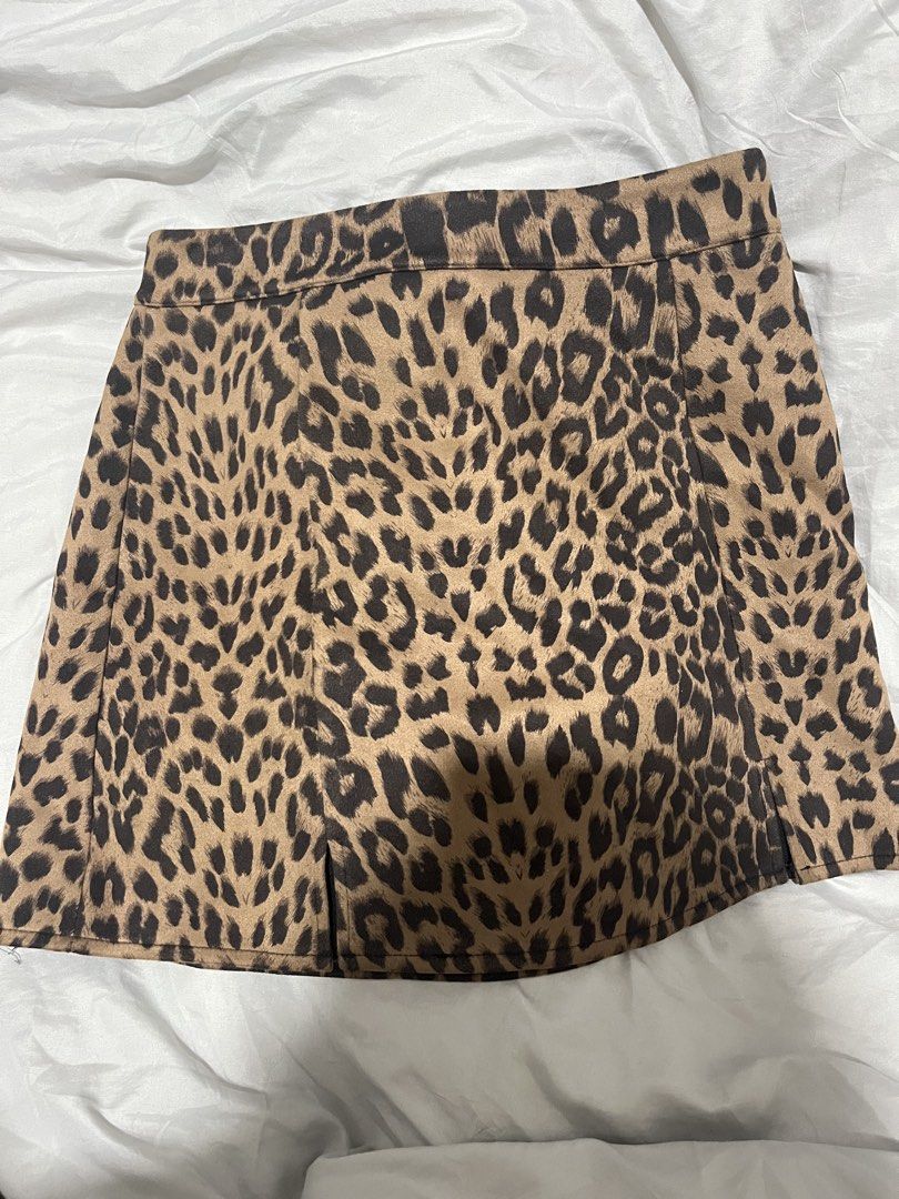 Leopard Print Mini Skirt with Slit (Category: Skirts) located in Manila. Submitted by jamalynnah (Listing ID 1460261818, Image 1). Description: Leopard print mini skirt, it has a zipper closure at the back. Used once. Size is 29-32..