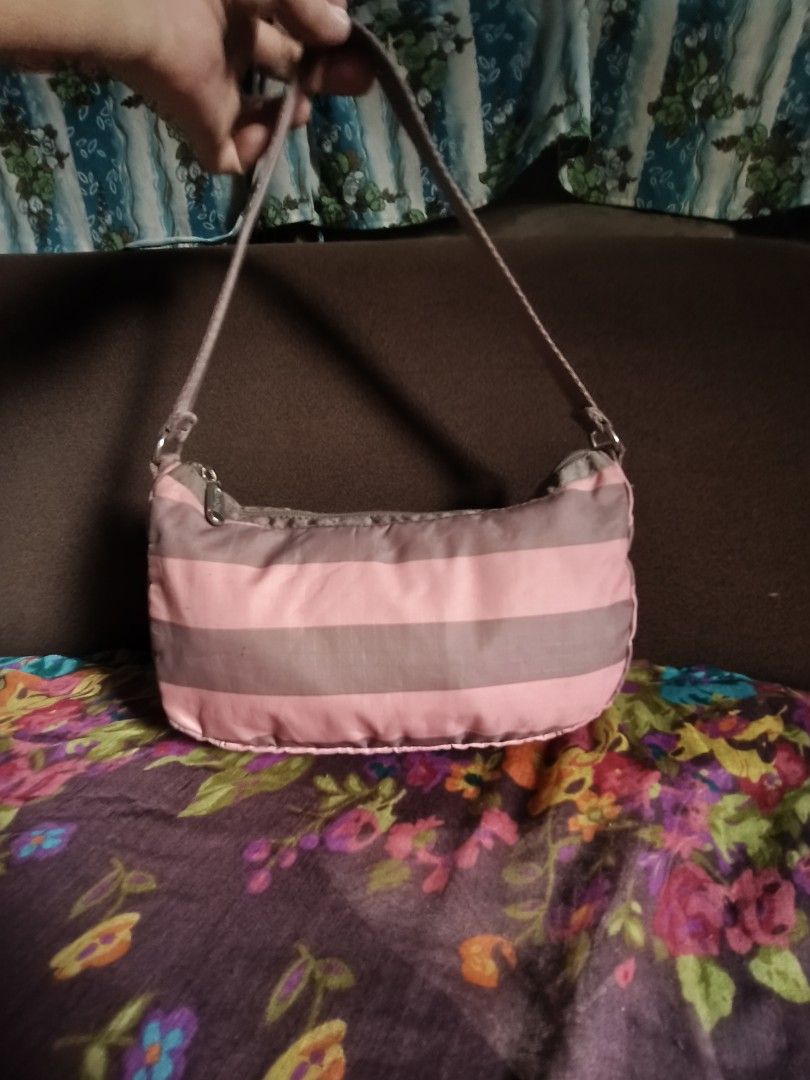 LESPORTSAC SHOULDER BAG (Category: Shoulder Bags) located in Las Pinas. Submitted by epicphoenix2022 (Listing ID 1460146731, Image 1). Description: - Cute shoulder bag with pink and grey stripes. - Small size, perfect for carrying essentials. - Secure zipper closure. - Adjustable strap for comfortable wear. - Great for casual outings and everyday use..