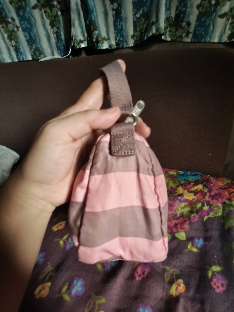 LESPORTSAC SHOULDER BAG (Category: Shoulder Bags) located in Las Pinas. Submitted by epicphoenix2022 (Listing ID 1460146731, Image 3). Description: - Cute shoulder bag with pink and grey stripes. - Small size, perfect for carrying essentials. - Secure zipper closure. - Adjustable strap for comfortable wear. - Great for casual outings and everyday use..