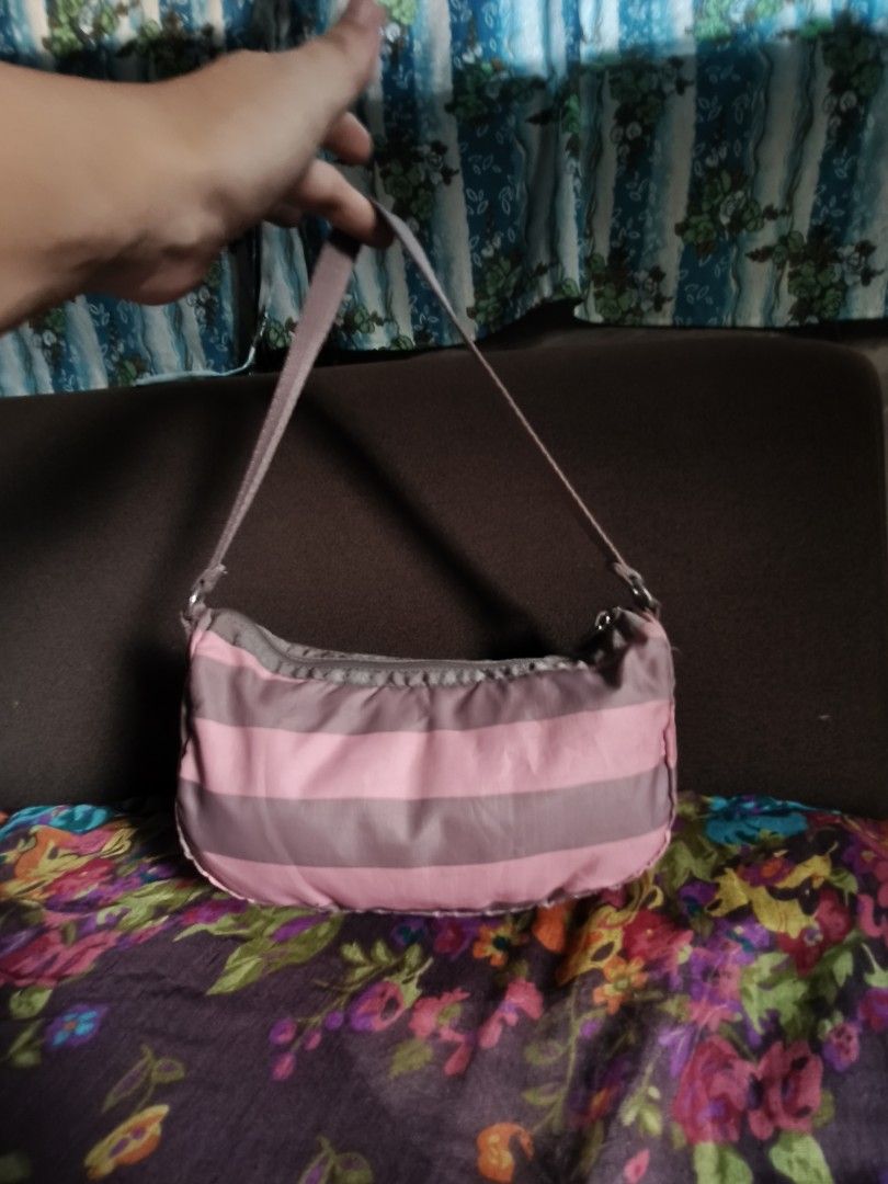 LESPORTSAC SHOULDER BAG (Category: Shoulder Bags) located in Las Pinas. Submitted by epicphoenix2022 (Listing ID 1460146731, Image 2). Description: - Cute shoulder bag with pink and grey stripes. - Small size, perfect for carrying essentials. - Secure zipper closure. - Adjustable strap for comfortable wear. - Great for casual outings and everyday use..