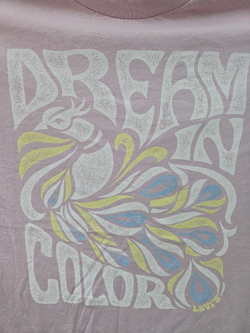 Levi's Pink Graphic T-Shirt (Category: Tshirts & Polo Shirts ) located in Tarlac. Submitted by resaleclub (Listing ID 1460153182, Image 2). Description: - Pink Levi's graphic t-shirt - Features a cool abstract design with 'Levi's' text - Size: Large (L/G) - Made in Bangladesh - Ideal for everyday casual wear.