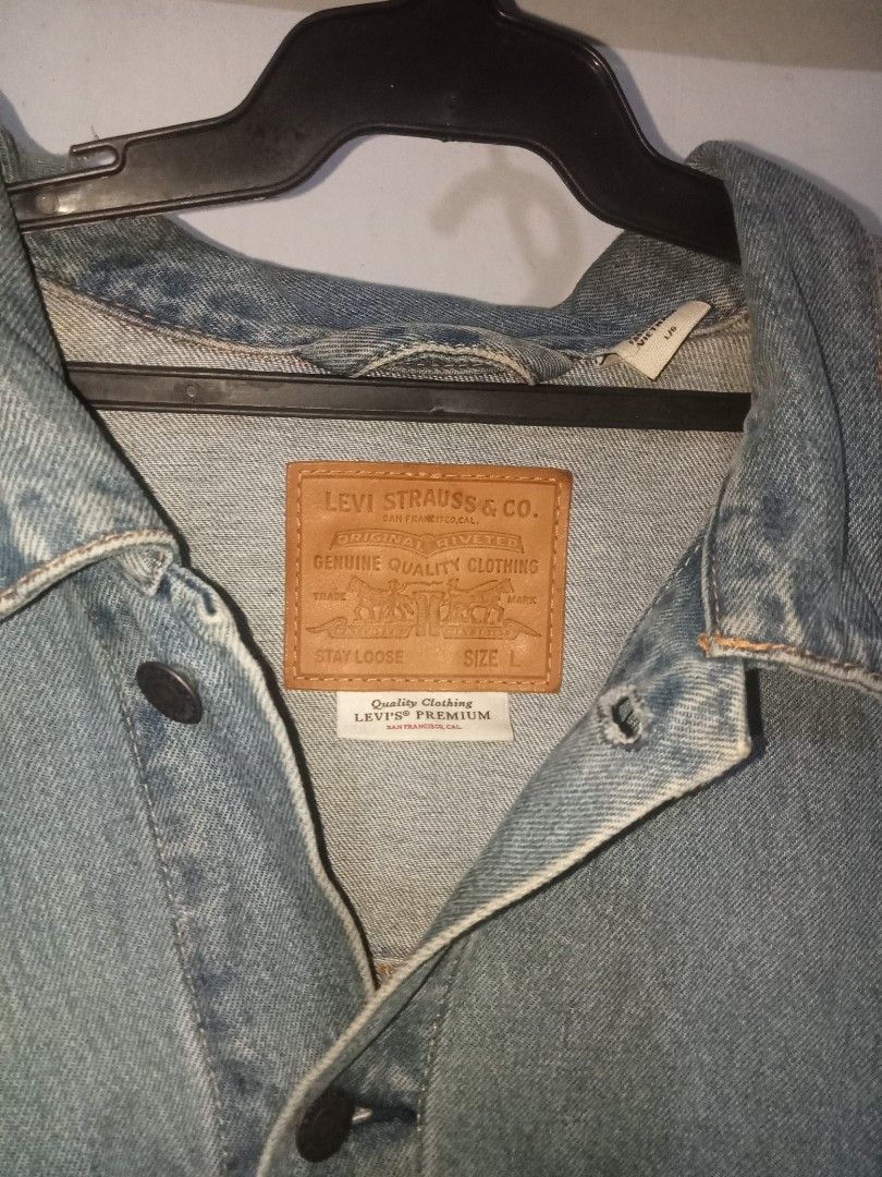 Levi's Strauss & Co. Denim Jacket (Category: Coats, Jackets and Outerwear) located in Manila. Submitted by wantcho.406 (Listing ID 1460198022, Image 1). Description: - Classic blue denim jacket from Levi's - Features iconic leather patch and metal buttons - Made with Water<Less technology - Great for layering - A staple piece for any wardrobe.