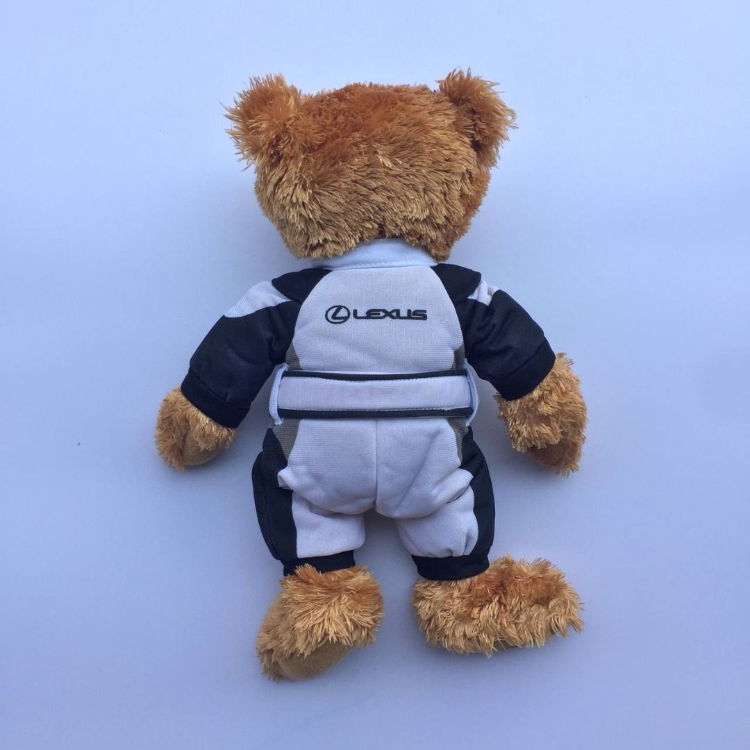 LEXUS Teddy Bear Plushie Plush (Category: Plushies & Soft Toys) located in Pagsanjan. Submitted by ovothrift (Listing ID 1460155609, Image 3). Description: height - 12.5 inches no issue very good condition authentic This is a promotional Lexus teddy bear plush wearing a branded white and black mechanic jumpsuit Removable white and black racing-style suit with dark shoulder panels, a waist belt, and the embroidered Lexus logo on the chest. Officia