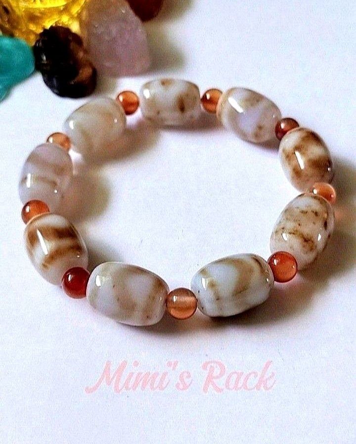 Light Brown Dzi Agate Natural Stone Barrel Bracelet (Category: Bracelets) located in Taguig. Submitted by mimisrack (Listing ID 1460259828, Image 1). Description: 🤎An earthy and timeless bracelet with traditional charm and grounding energy -Unique natural patterns and polished finish -Gives a balanced, vintage, and spiritual-inspired aesthetic -Dzi agate is believed to symbolize protection, luck, harmony, and positive energy 🧿 Bead size: 11mm �