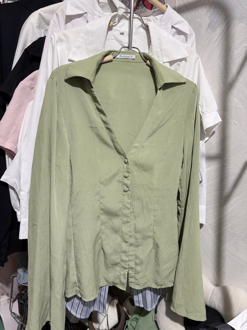 Light Green Button-Up Long Sleeve Shirt (Category: Tshirts & Polo Shirts ) located in San Jose del Monte. Submitted by pmarcos72714535 (Listing ID 1460115863, Image 2). Description: - Light green long sleeve shirt - Button-up front with a V-neckline - Features a stylish collar detail - Elegant bell sleeves - Textured fabric for a unique look - Perfect for dressing up or down Fits Medium to semi large Loc: Sun valley paranaque .