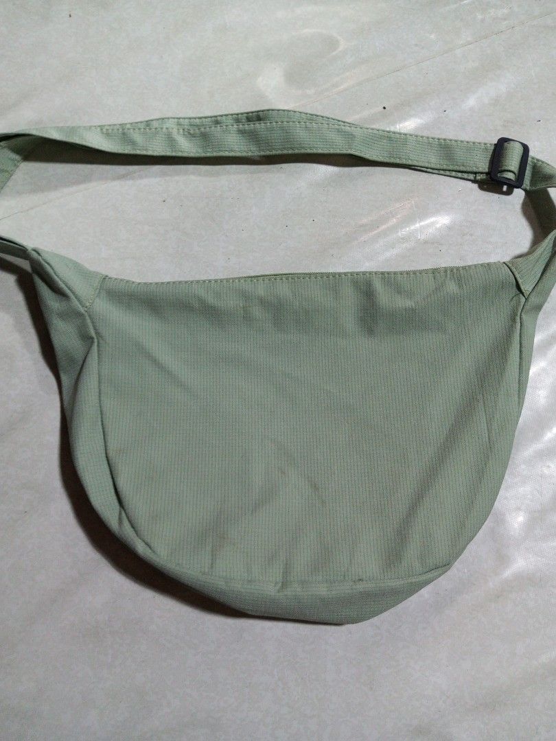 Light Green Corduroy Sling Bag (Category: Cross-body Bags) located in Malolos. Submitted by radapostol (Listing ID 1460163839, Image 1). Description: - Trendy light green corduroy sling bag - Features a subtle ribbed texture - Adjustable strap with a black buckle for a custom fit - Ideal for everyday use and casual outings.