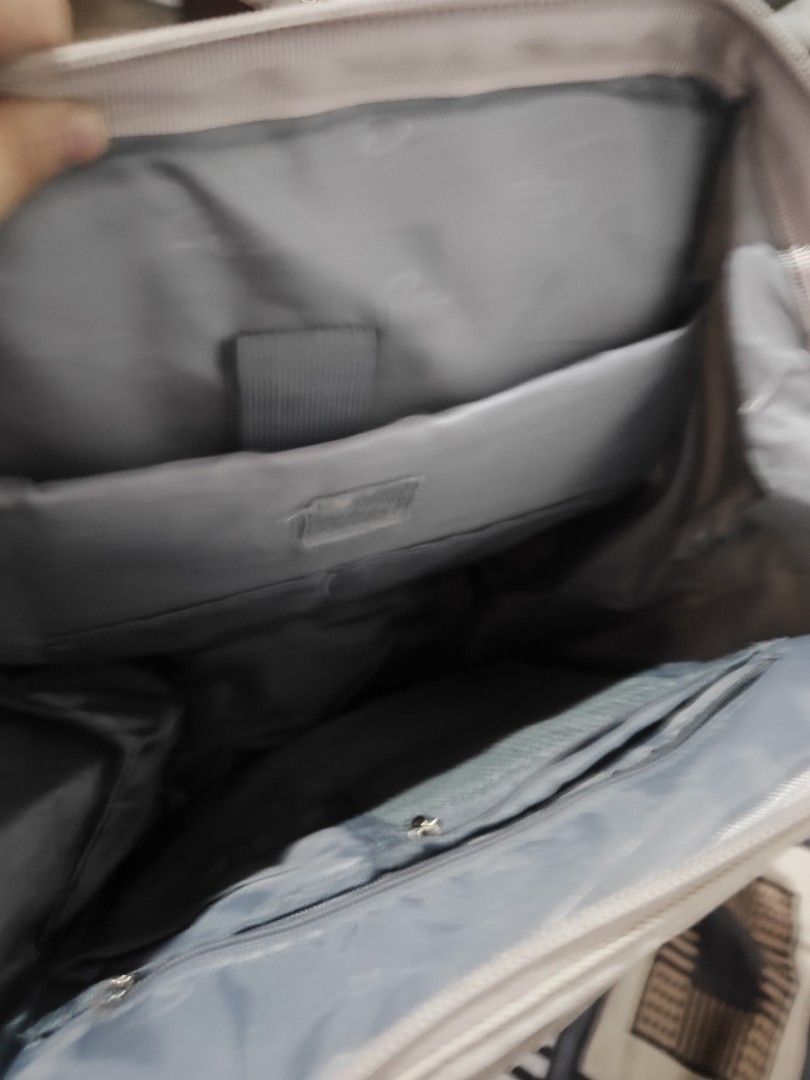Light Grey Kipling Backpack (Category: Backpacks) located in Caloocan City. Submitted by royalwind.55b283 (Listing ID 1460213958, Image 2). Description: - Light grey Kipling backpack - Multiple zippered compartments for organization - Main compartment with internal pockets - Adjustable shoulder straps - Minor signs of wear (small snag on front pocket stitching) - Ideal for everyday use or travel.
