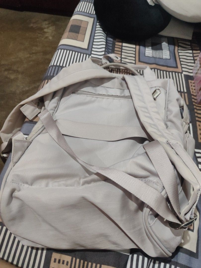 Light Grey Kipling Backpack (Category: Backpacks) located in Caloocan City. Submitted by royalwind.55b283 (Listing ID 1460213958, Image 3). Description: - Light grey Kipling backpack - Multiple zippered compartments for organization - Main compartment with internal pockets - Adjustable shoulder straps - Minor signs of wear (small snag on front pocket stitching) - Ideal for everyday use or travel.