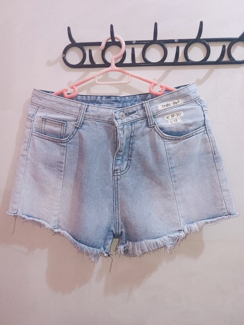 Light Wash Distressed Denim Shorts (Category: Shorts) located in Manila. Submitted by essarazas (Listing ID 1460193640, Image 2). Description: Cute light wash denim shorts. Features a distressed hem and some rips. Button fly closure. Great for casual wear. Easy to pair with any top. Grab these comfy shorts now..