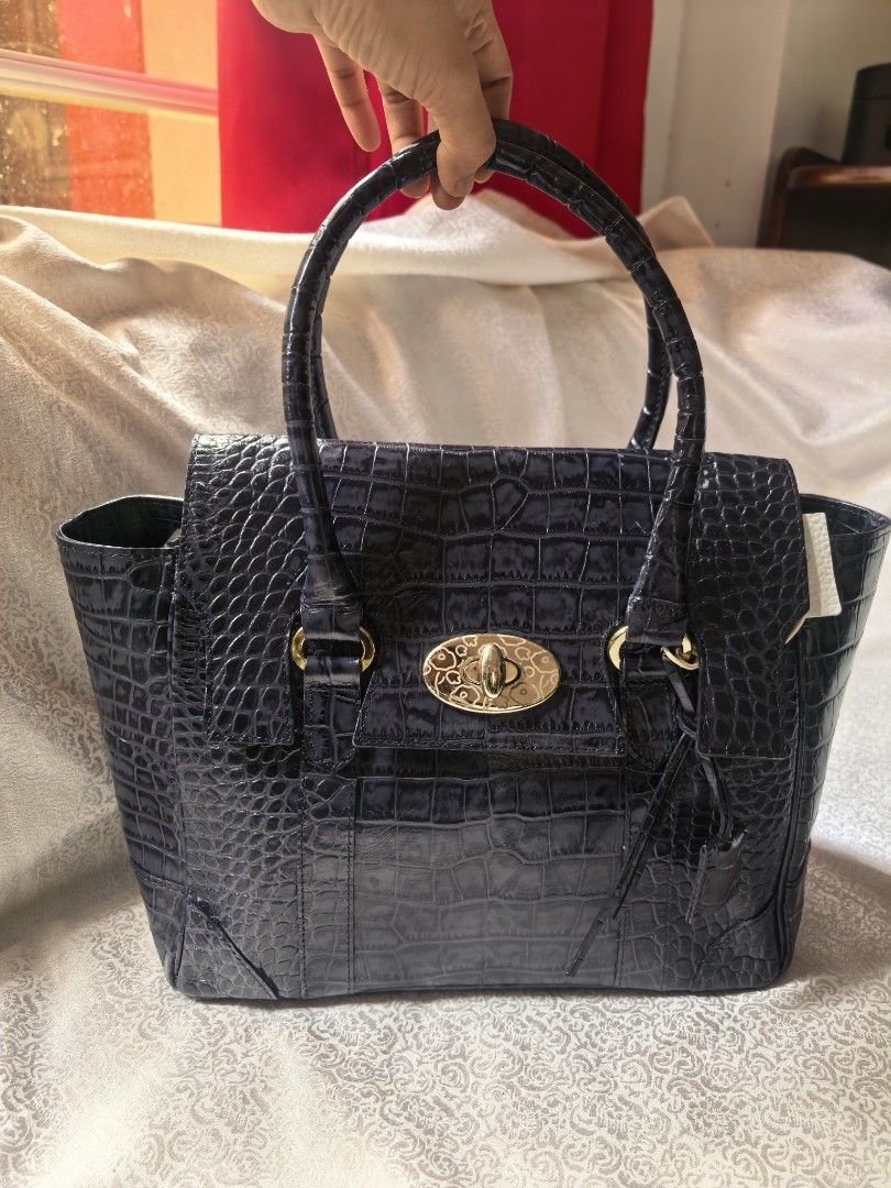 Like new Croc effect leather handbag (Category: Tote Bags) located in Tuguegarao City. Submitted by zenphoenix-7ad615 (Listing ID 1460158439, Image 2). Description: Pretty in actual.
