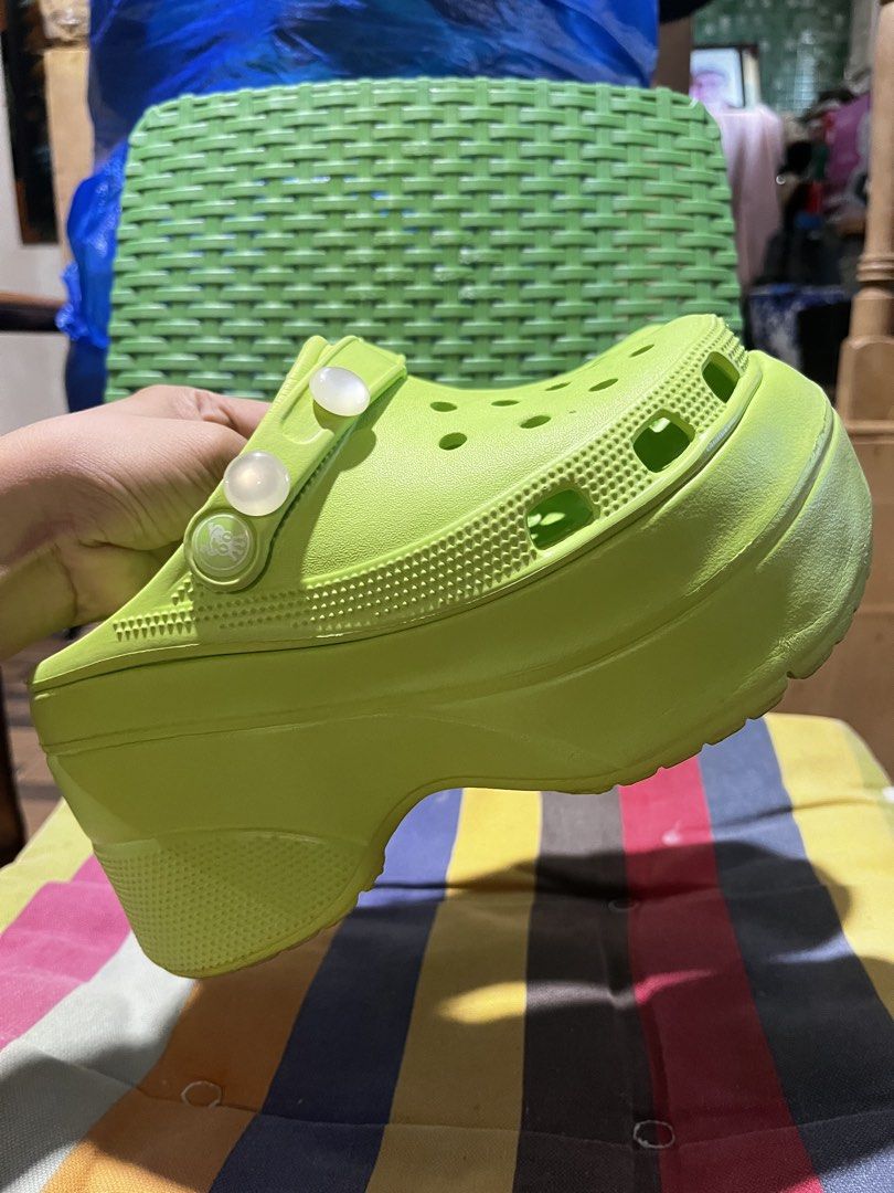 Lime Green Platform Crocs Clogs (Category: Slippers and slides) located in Davao. Submitted by wornbycathy (Listing ID 1460300504, Image 1). Description: Super bright lime green platform Crocs. These have a chunky sole for extra height. Easy to slip on and off. Great for casual wear or festivals. Get these fun clogs now!.