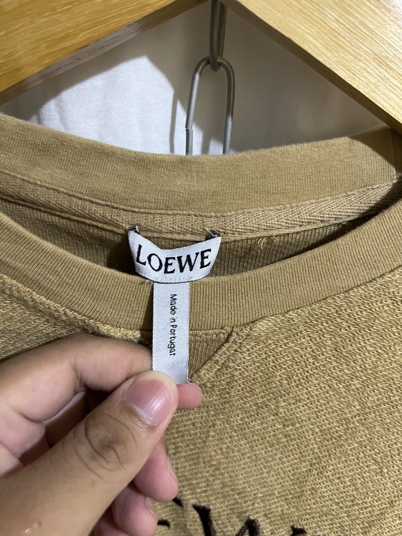 Loewe Anagram Logo Sweatshirt Tan (Category: Coats, Jackets and Outerwear) located in Manila. Submitted by dailypicksbyclyde (Listing ID 1460205673, Image 3). Description: Loewe Inside Up Small to medium mens Issues check pics Good cndition Tight neckline .