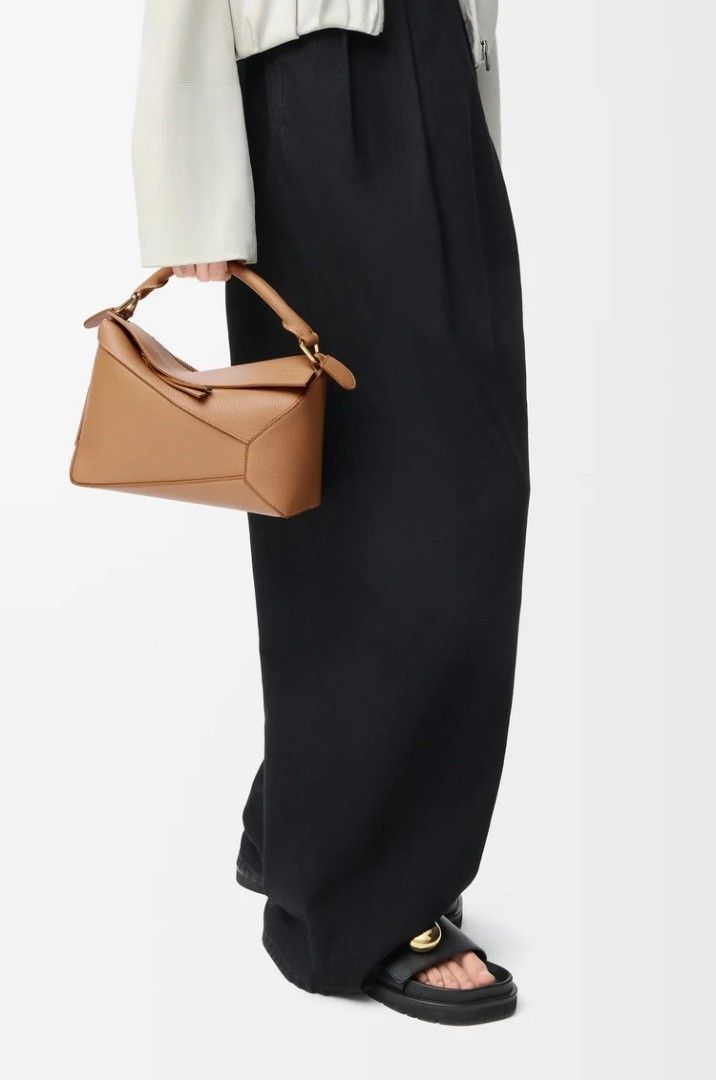 Loewe Puzzle Mini Bag Tan Leather (Category: Luxury Bags & Wallets) located in Macrohon. Submitted by vestiaryse42944 (Listing ID 1460153740, Image 3). Description: Tan leather mini bag. Wear as crossbody, shoulder bag, or with top handle. Detachable strap included. Perfect for day or night.NGA/Preloved. Japan Sourced. BUY at your own risk! Still in like new condition. Pls refer to photos posted. SURE BUYERS ONLY PLS!!.