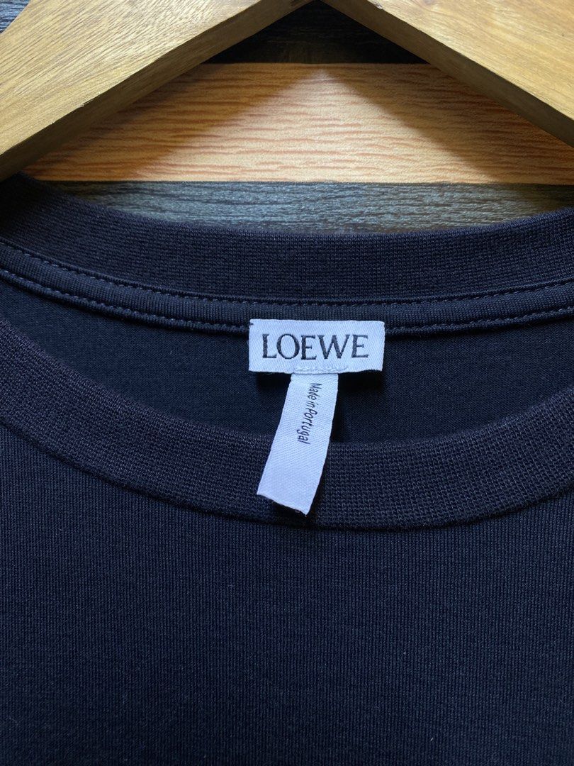 LOEWE Regular Fit Anagram (Category: Tshirts & Polo Shirts ) located in Makati City. Submitted by drip.poww (Listing ID 1460218459, Image 3). Description: - Authentic Loewe - Color: Black - Size: Small - Dimes: 19x27 - Authentic - Excellent condition - Need wash, fresh from bale - Material: 100% Cotton Please don’t expect too much—these are thrifted (ukay) items. 😊 !!STILL NEGOTIABLE!!.