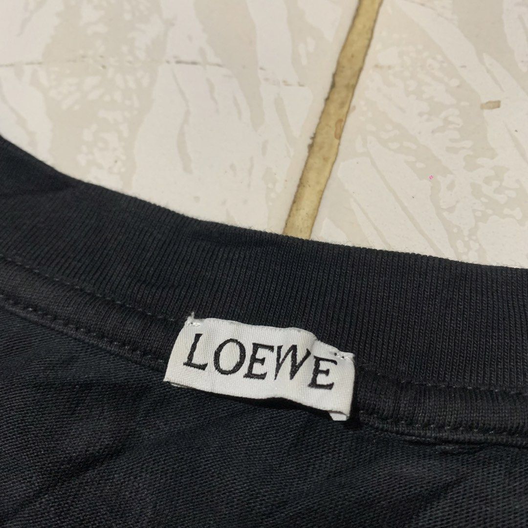 Loewe Tee (Category: Tshirts & Polo Shirts ) located in Cebu City. Submitted by johnferrer96412 (Listing ID 1460173103, Image 3). Description: Loewe Tee Embroidered Logo Small fit Med Width 21 Length 26.5 Excellent condition Color rate 9.5/10 Dm📩.
