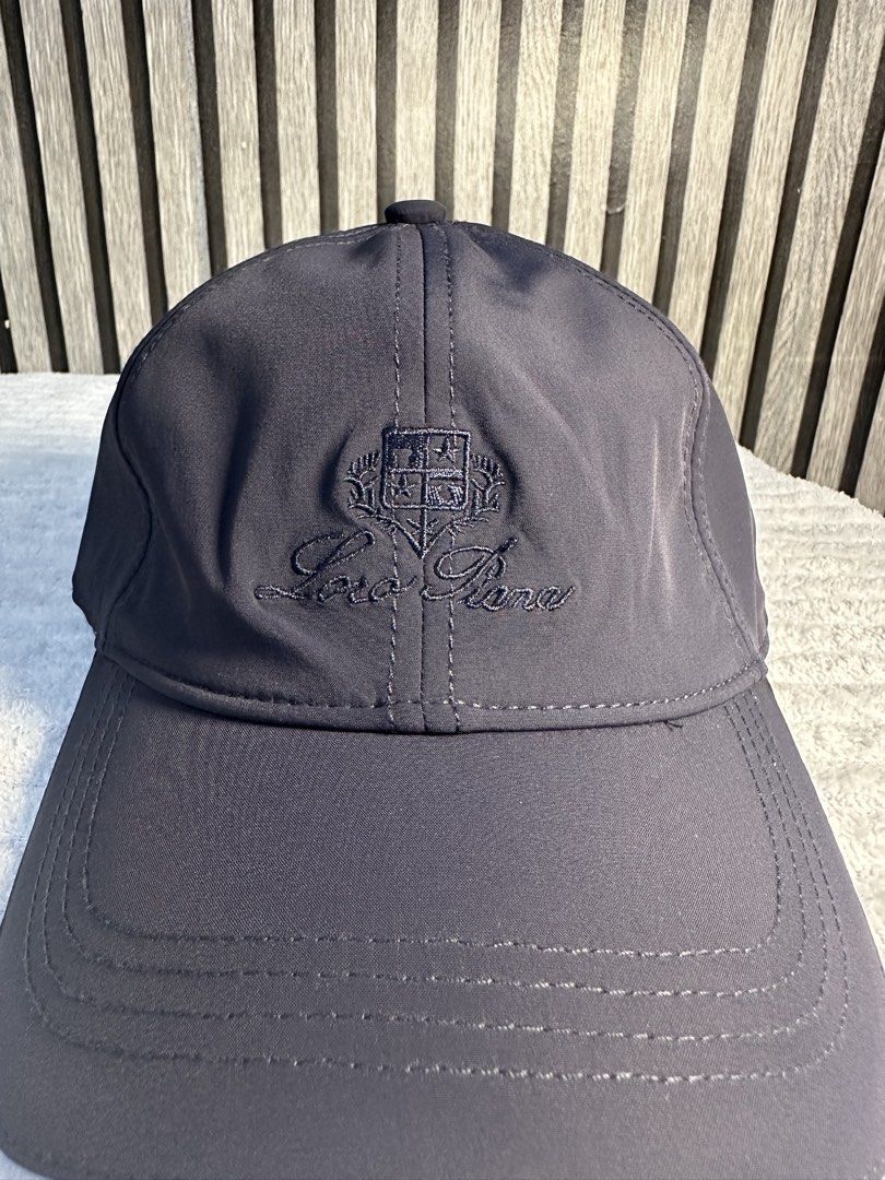 Loro Piana Baseball Cap (Category: Caps & Hats) located in Manila. Submitted by aoparaiso (Listing ID 1460261290, Image 1). Description: - Dark grey Loro Piana baseball cap - Features embroidered Loro Piana crest and script logo on the front - Classic and simple design - Perfect for everyday wear.