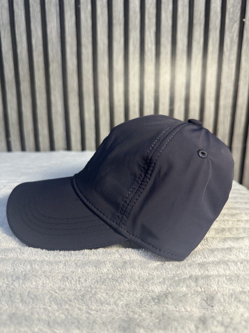 Loro Piana Baseball Cap (Category: Caps & Hats) located in Manila. Submitted by aoparaiso (Listing ID 1460261290, Image 2). Description: - Dark grey Loro Piana baseball cap - Features embroidered Loro Piana crest and script logo on the front - Classic and simple design - Perfect for everyday wear.