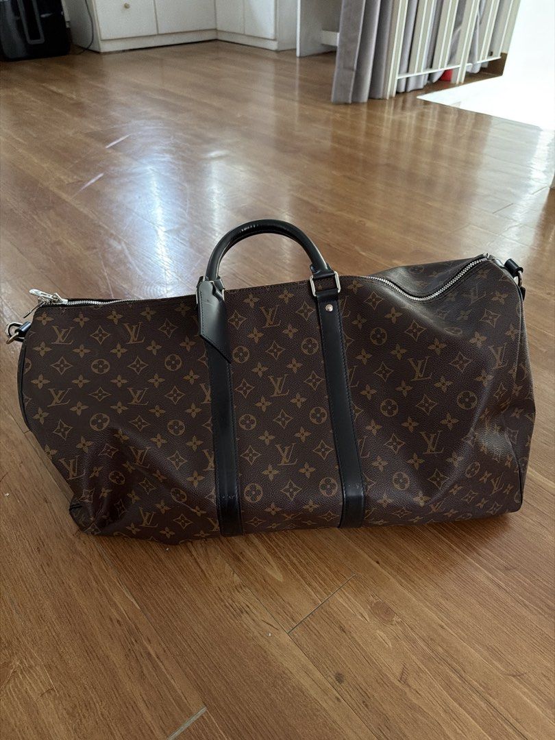 Louis Vuitton Monogram Keepall Duffle Bag (Category: Luxury Bags & Wallets) located in Manila. Submitted by sphfrnndz (Listing ID 1460106819, Image 1). Description: - Classic Louis Vuitton Keepall duffle bag - Monogram canvas with black leather trim and handles - Spacious interior with a zippered pocket - Ideal for travel or weekend getaways - Comes with original luggage tag - Zippers and hardware are in good working condition.