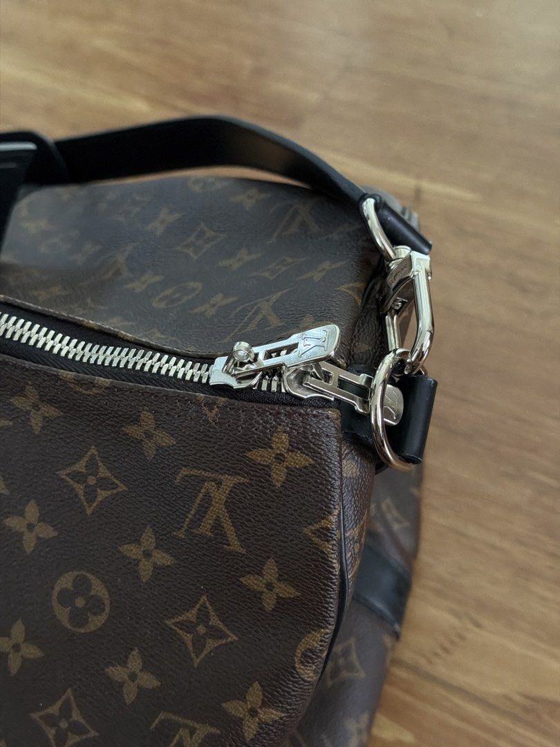 Louis Vuitton Monogram Keepall Duffle Bag (Category: Luxury Bags & Wallets) located in Manila. Submitted by sphfrnndz (Listing ID 1460106819, Image 3). Description: - Classic Louis Vuitton Keepall duffle bag - Monogram canvas with black leather trim and handles - Spacious interior with a zippered pocket - Ideal for travel or weekend getaways - Comes with original luggage tag - Zippers and hardware are in good working condition.