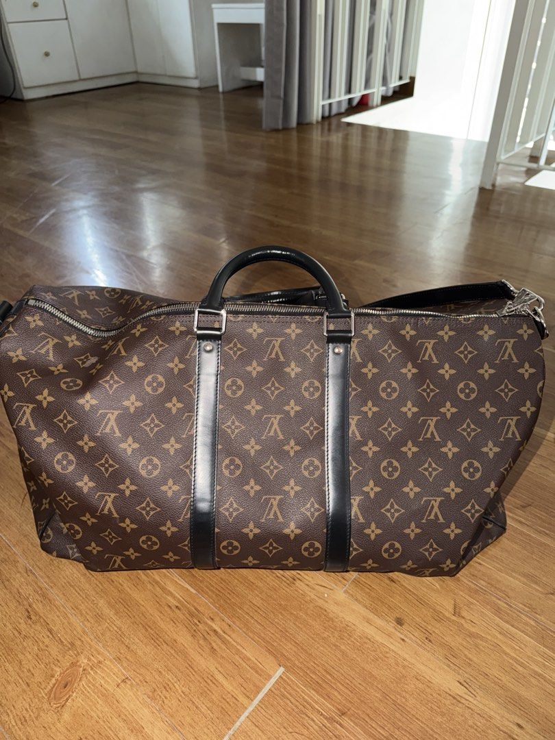 Louis Vuitton Monogram Keepall Duffle Bag (Category: Luxury Bags & Wallets) located in Manila. Submitted by sphfrnndz (Listing ID 1460106819, Image 2). Description: - Classic Louis Vuitton Keepall duffle bag - Monogram canvas with black leather trim and handles - Spacious interior with a zippered pocket - Ideal for travel or weekend getaways - Comes with original luggage tag - Zippers and hardware are in good working condition.