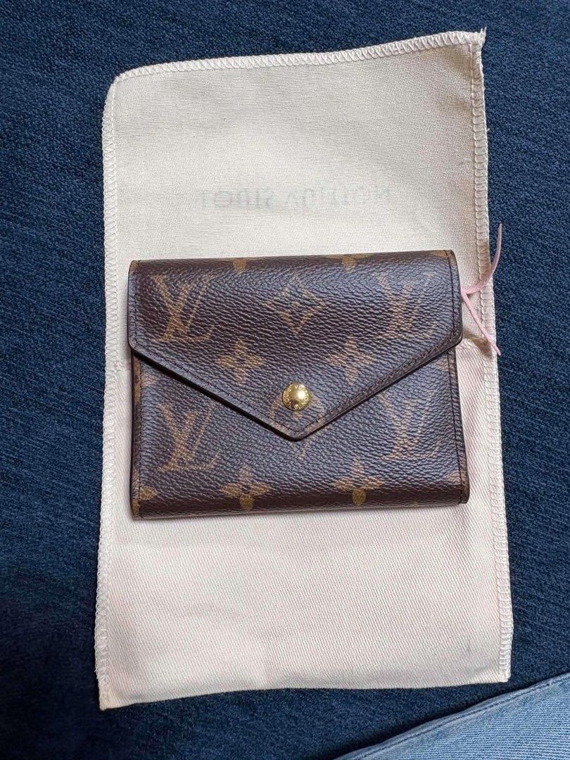 Louis Vuitton Monogram Small Wallet (Category: Luxury Bags & Wallets) located in Paranaque City. Submitted by Mi_Hermosa (Listing ID 1460261934, Image 1). Description: - Authentic Louis Vuitton small wallet - Classic monogram canvas exterior - Interior: Lovely pink leather - Multiple card slots - Zippered compartment for coins - Comes with original dust bag - Ideal for everyday use.