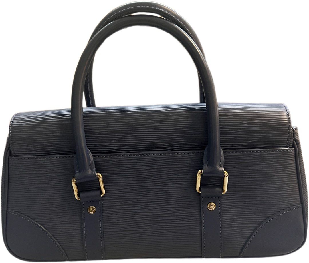 Louis Vuitton Segur Epi Leather Handbag (Category: Luxury Bags & Wallets) located in Muntinlupa City. Submitted by chiaraa400 (Listing ID 1460211023, Image 3). Description: - Classic Louis Vuitton Segur handbag in beautiful Myrtle blue Epi leather with smooth leather trim accent - Features the iconic LV lock closure. - Interior includes a convenient slip pocket. - with dust bag - Versatile for everyday use or special events. - A timeless luxury p