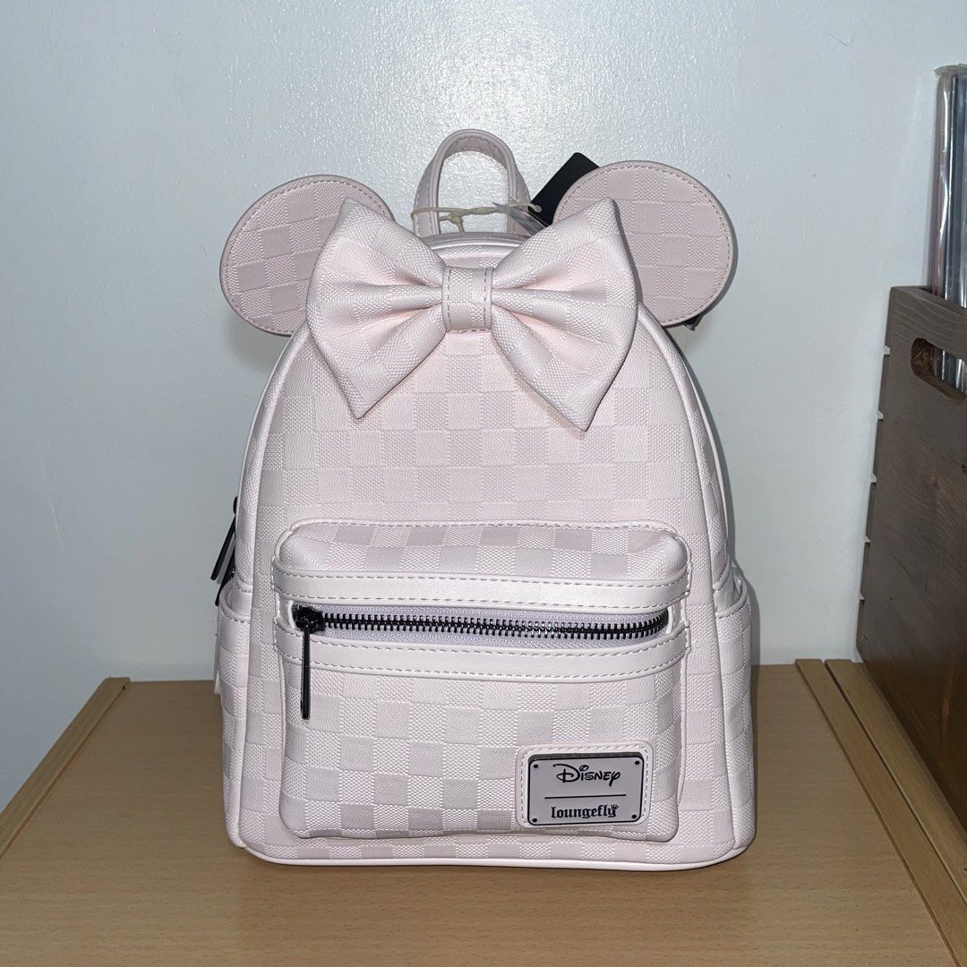 Loungefly Disney Minnie Mouse Light Pink Backpack (Category: Backpacks) located in Paranaque City. Submitted by eiiaaa (Listing ID 1460280749, Image 2). Description: Onhand! Brand new with tag. Unused. Bought at Hong Kong Disneyland last August 28, 2026. No flaws. Bought for 649HKD.