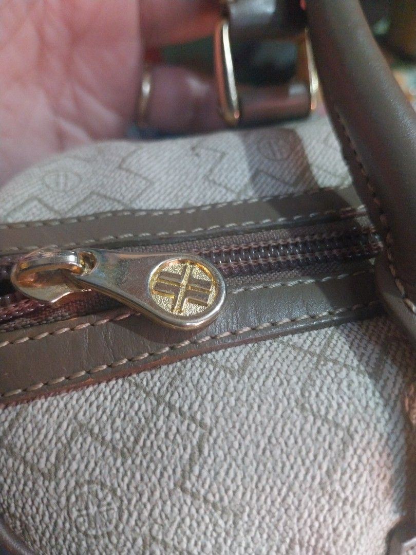 Louvier Monogram Canvas Handbag (Category: Luxury Bags & Wallets) located in Manila. Submitted by herlaniepa00965 (Listing ID 1460127290, Image 2). Description: - Louvier monogram canvas handbag - Classic design with leather trim - Elegant gold hardware - Secure zipper closure - Interior features Louvier branding - Ideal for everyday use - A chic and stylish accessory.