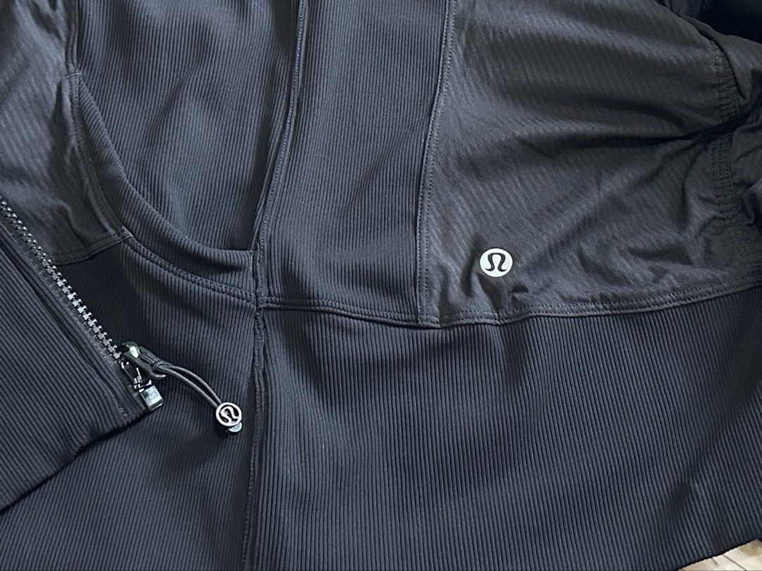 Lululemon Black Hoodie Jacket (Category: Coats, Jackets and Outerwear) located in Manila. Submitted by alejeong27 (Listing ID 1460183466, Image 3). Description: - Lululemon zip-up hoodie in black - Size 10 - Features thumbholes for a secure fit - Comfortable hood for extra warmth - Subtle Lululemon logo on both front and back - Ideal for workouts, athleisure, or casual wear.
