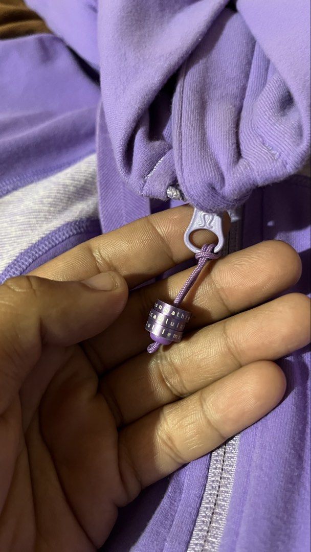 Lululemon Purple Hoodie Jacket Size 6 (Category: Coats, Jackets and Outerwear) located in Manila. Submitted by shortavenue (Listing ID 1460208132, Image 3). Description: - Bright purple Lululemon hoodie - Size 6 - Iconic Lululemon logo on front - Zippered pockets for secure storage - Drawstring hood for adjustable coverage - Ideal for workouts or casual wear.
