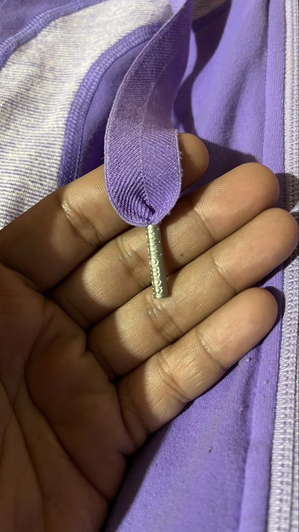 Lululemon Purple Hoodie Jacket Size 6 (Category: Coats, Jackets and Outerwear) located in Manila. Submitted by shortavenue (Listing ID 1460208132, Image 2). Description: - Bright purple Lululemon hoodie - Size 6 - Iconic Lululemon logo on front - Zippered pockets for secure storage - Drawstring hood for adjustable coverage - Ideal for workouts or casual wear.