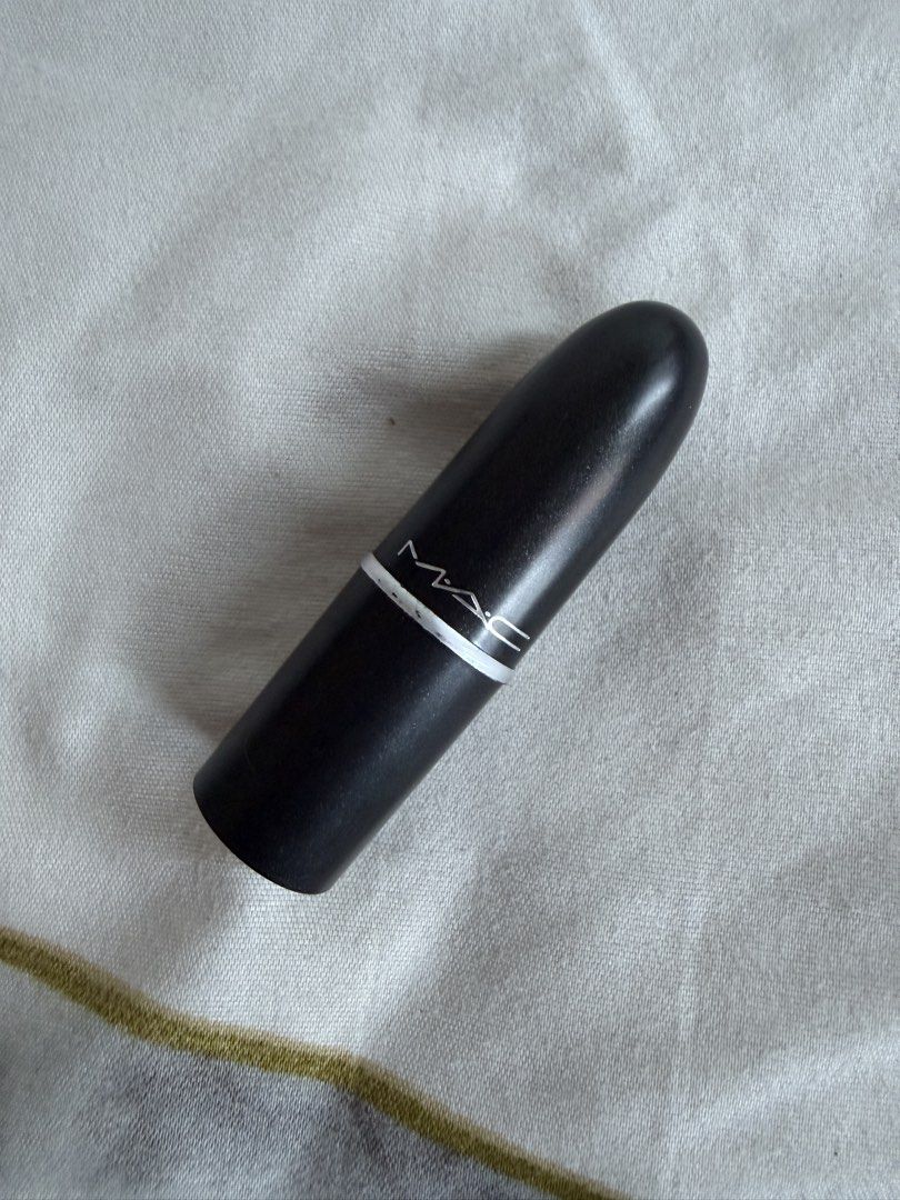 MAC Lipstick (Category: Makeup) located in Mandaluyong City. Submitted by xthinejavier (Listing ID 1460197697, Image 1). Description: - MAC Lipstick mini size - Classic black case - Shade: Tropic Tonic (Coral-pink shade) - Condition: Only swatched once on arm - Plenty of product remaining - Ideal for everyday wear or adding a pop of color.