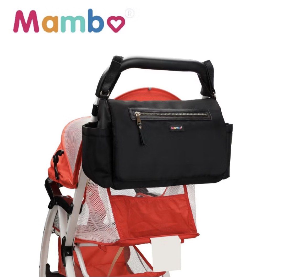 Mambo Nylon Waterproof Stroller / Diaper Bag (Category: Diaper Bags & Wetbags) located in Manila. Submitted by alliecat21 (Listing ID 1460192021, Image 2). Description: Selling my Mambo black multi-function bag. Perfect for moms, travel, or everyday use! 🖤 ✨ Super Spacious & functional with multiple compartments ✨ Front zipper pocket + back pockets ✨ Side pockets for bottles/small essentials ✨ Adjustable shoulder strap ✨ Gold-tone hardware ✨ Lig