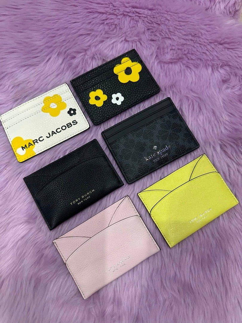 Marc Jacobs, Kate Spade, Tory Burch Cardholders (Category: Wallets & Card holders) located in Caloocan City. Submitted by sizzies_fashion_style (Listing ID 1460109173, Image 1). Description: Marc Jacobs (flower design) Kate Spade (black) Tory Burch (black, pink, and yellow) - Ideal for keeping your cards organized ₱1,500 each.